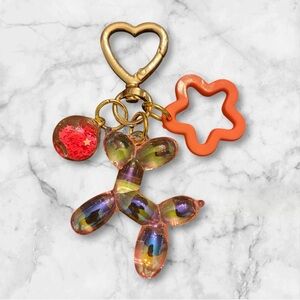 Iridescent Balloon Dog Keychain with Orange Star Charm